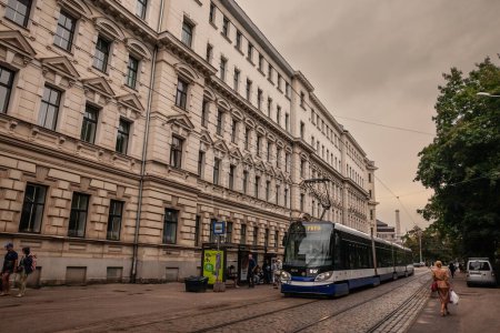 Photo for RIGA, LATVIA - AUGUST 25, 2023: Skoda 15T tram in the streets of Riga city center. Riga tram, operated by Rigas Satiksme, is part of the riga tram public transportation system. - Royalty Free Image