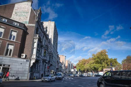 Photo for LIEGE, BELGIQUE - NOVEMBER 9, 2022: Panorama of car traffic in Boulevard d'Avroy , a street of the city center of Liege, with facades of old buildings. it's a major street of Wallonia. - Royalty Free Image