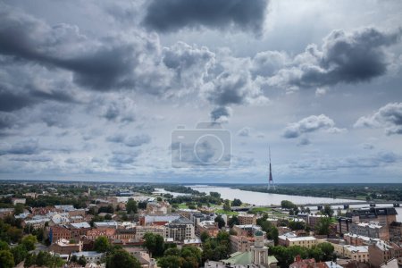Photo for Aerial Panorama of Riga with the daugava river during a sunny afternoon, with the radio and tv tower in background. Riga is the capital city of Latvia, in the baltic countries. - Royalty Free Image