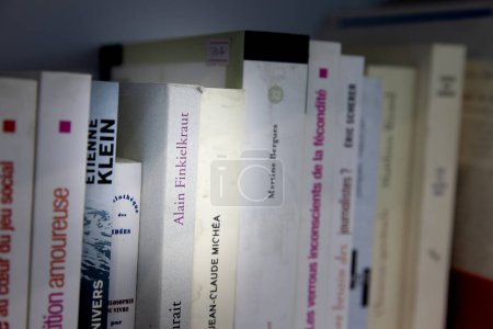 Photo for BELGRADE, SERBIA - OCTOBER 23, 2023: Selective blur on the covers of Alain Finkielkraut books on the shelves of a bookstore of Belgrade. Finkielkraut is a french author, essayist and intellectual. - Royalty Free Image