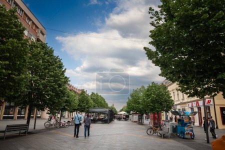 Photo for ZRENJANIN, SERBIA - MAY 20, 2023: kralja aleksandra i karadjordjevica street, the main pedestrian street of Zrenjanin in the afternoon. it's one of main streets of the center of this city of Voivodina. - Royalty Free Image