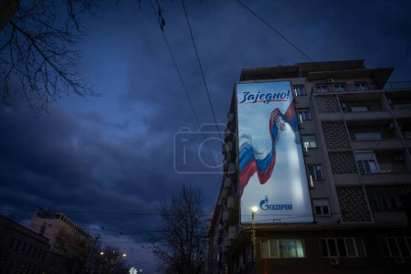 Photo for BELGRADE, SERBIA - JANUARY 17, 2024: advertisement of Gazprom with propaganda message "together" with flags of Serbia and Russia on relations of countries. Gazprom is a russian oil producer & seller. - Royalty Free Image