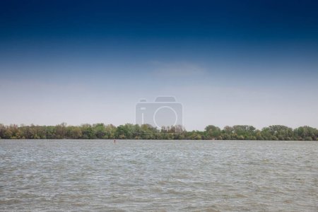 Photo for Panorama of the danube waters in Belgrade, Serbia, with a blue sky. Reka dunav, or danube river, is a major river of Europe and a huge navigation axis. - Royalty Free Image