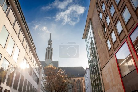 Street of Dortmund with the Propstein kirche, or Sankt Johannes Baptist Kirche church in the center of the city. Saint Johann Baptist church is a catholic church.