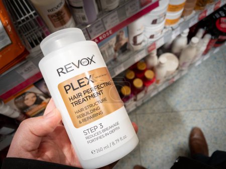 Photo for BELGRADE, SERBIA - FEBUARY 23, 2024: Revox B77 Plex logo on a hair perfecting treatment bottle. Revox B77 is a european cosmetics brand. - Royalty Free Image