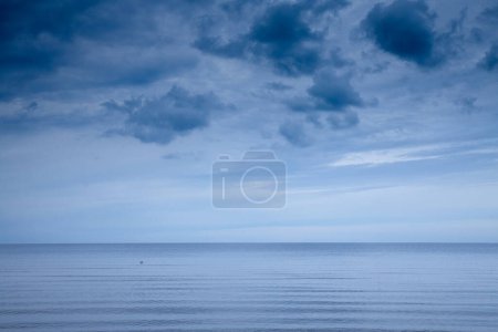 Panorama of the Jurmala beach (Jurmalas Pludmale) in Dubulti, Latvia, on the baltic sea, during a rainy foggy cloudy afternoon. Jurmala is one of the sea resorts of Latvia in the baltic states.