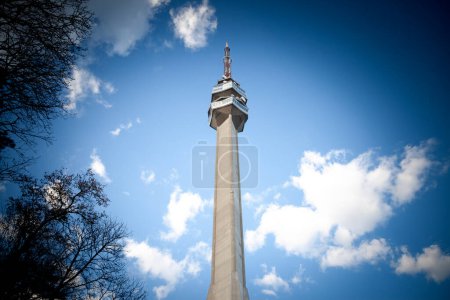 Photo for Panorama of the avala hill skyline with a focus on Avala tower, or Avala toranj,with a blue sky. It is a TV tower and broadcasting antenna in the suburbs of Belgrade, Serbia. - Royalty Free Image