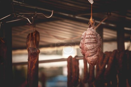 Serbian Sremski Kulen Kobasica sausage, handmade, hanging and drying in the coutryside of Serbia. Kulen is a traditional pork sausage, dry and cured, from Croatia and Serbia, from region of Srem.