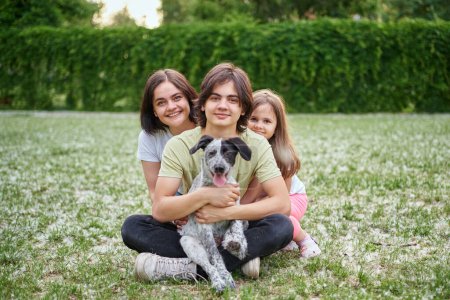 Photo for Support, care or happy family, woman and kids bonding with foster puppy or pet and enjoying time together. High quality photo - Royalty Free Image