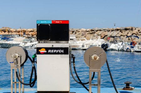 Photo for SAN JOSE, SPAIN - 23 MAY 2023 Point of fuel Repsol  supply to ships stationed in the bay in the town of San Jose, in the centre of Parque Natural de Cabo de Gata, Almeria province - Royalty Free Image
