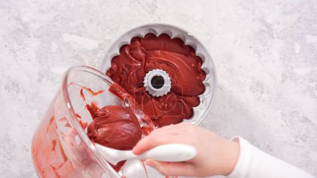 Photo for Flat lay. Step by step. Pouring cake batter into a bundt cake pan to bake a red velvet bundt cake. - Royalty Free Image