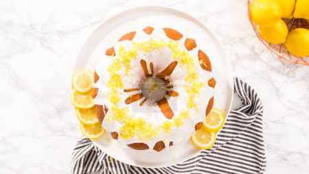Flat lay. Step by step. Garnishing lemon bundt cake with lemon zest on top of the white glaze.