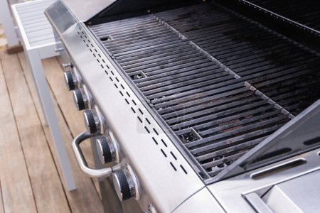 Photo for Clean six-burner gas grill ready for summer grilling. - Royalty Free Image