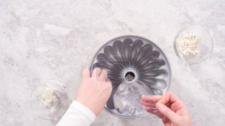 Photo for Flat lay. Step by step. Greasing bundt cake pan with vegetable shortening and sprinkling with white flour. - Royalty Free Image