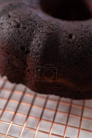 Photo for Cooling freshly baked red velvet bundt cake on a kitchen counter. - Royalty Free Image