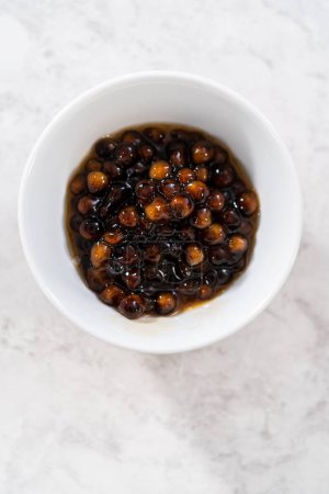 Photo for Freshly cooked boba pearls in a small white bowl. - Royalty Free Image