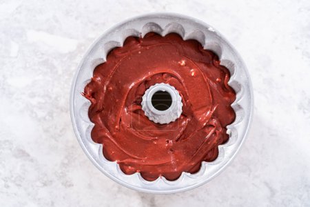 Photo for Red velvet cake batter in a bundt cake pan. - Royalty Free Image