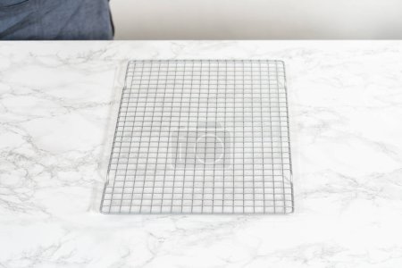 Photo for Empty baking drying rack on a marble surface. - Royalty Free Image