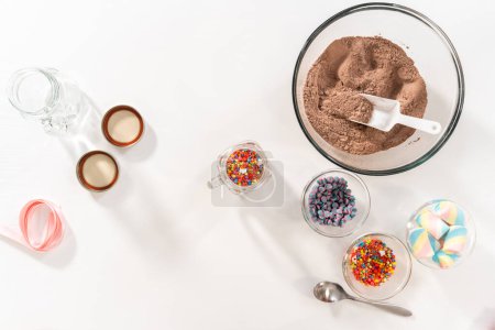 Photo for Flat lay. Making unicorn hot chocolate mix in drinking mason jar as a food gift. - Royalty Free Image