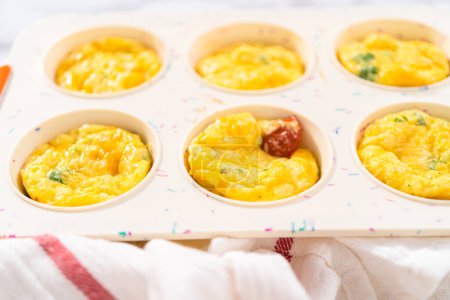 Photo for Cooling fresh out of the oven bacon and cheese egg muffin. - Royalty Free Image
