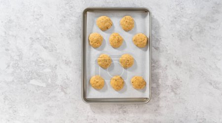 Photo for Flat lay. Cooling freshly banana cookies on a kitchen counter. - Royalty Free Image