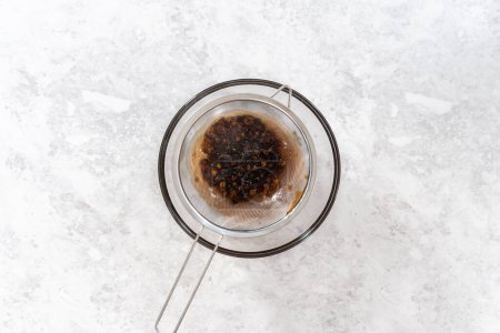 Photo for Flat lay. Draining freshly cooked boba pearls through a mesh strainer. - Royalty Free Image