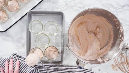 Photo for Flat lay. Step by step. Scooping homemade chocolate ice cream into glass jars. - Royalty Free Image