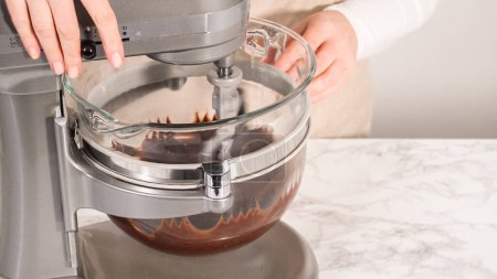 Photo for Step by step. Whipping chocolate ganache with an electric kitchen mixer. - Royalty Free Image