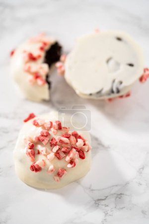 Photo for Stach of freshly baked peppermint white chocolate cookies on a marble background. - Royalty Free Image