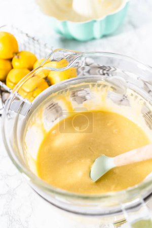 Photo for Lemon pound cake batter in a glass mixing bowl. - Royalty Free Image