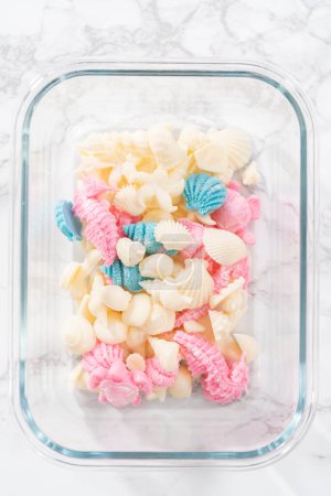 Photo for Chocolate mermaid tails and seashells in a glass container. - Royalty Free Image