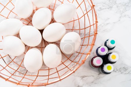 Foto de Easter egg coloring. Measured ingredients in glass mixing bowls to dye Easter eggs. - Imagen libre de derechos