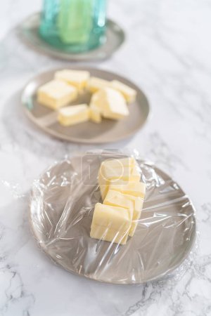 Photo for Softened sticks of unsalted butter on the counter. - Royalty Free Image