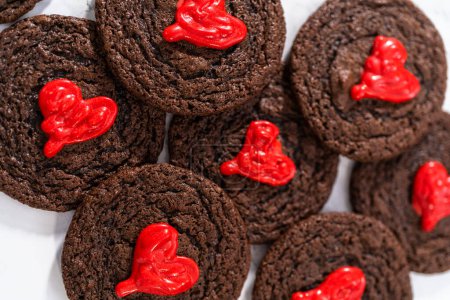Photo for Freshly baked chocolate cookies with chocolate hearts for Valentines Day. - Royalty Free Image