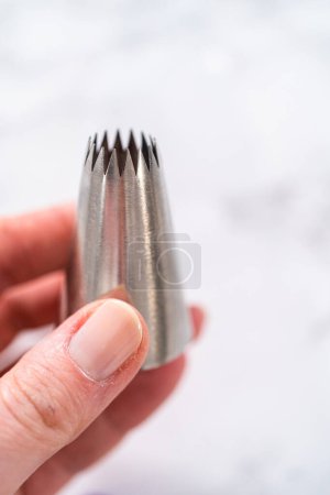 Photo for Jumbo metal piping tip for cupcake frosting. - Royalty Free Image