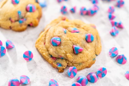 Photo for Freshly baked unicorn chocolate chip cookies with rainbow chocolate chips on the counter. - Royalty Free Image