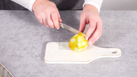 Photo for Step by step. Squeezing fresh lemons for baking lemon cranberry bundt cake. - Royalty Free Image