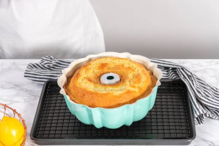 Photo for Freshly baked lemon bundt cake in a bundt cake pan. - Royalty Free Image