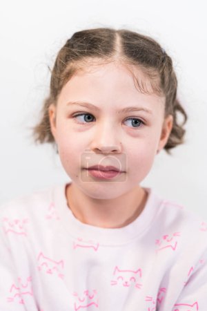Photo for Little girl with rainbow braces smiling at the camera. - Royalty Free Image