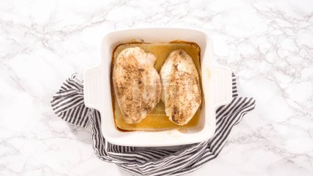 Photo for Flat lay. Step by step. Freshly baked chicken in a white ceramic baking dish. - Royalty Free Image
