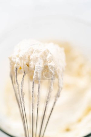Photo for Whisk with homemade whipped cream. Freshly whipped. - Royalty Free Image