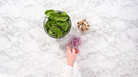 Photo for Flat lay. Step by step. Ingredients in glass mixing bowls to prepare spinach and ham frittata. - Royalty Free Image