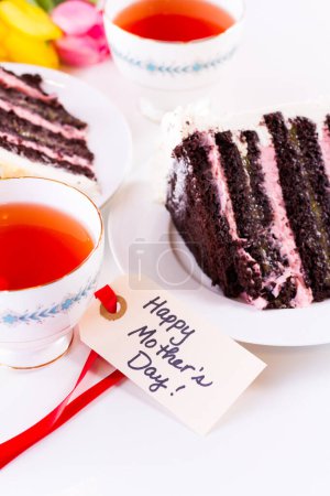 Photo for Chocolate Strawberry Lemon Torte made with 6 layers of chocolate cake, filled with lemon curd and strawberry mousse, covered in white chocolate cream cheese frosting. - Royalty Free Image