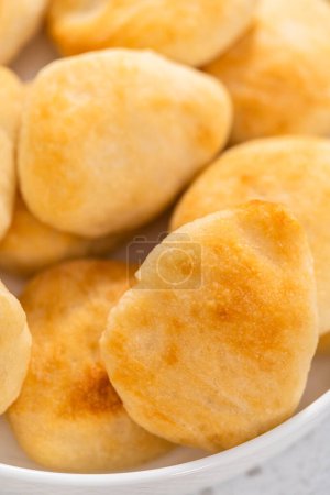 Photo for Serving homemade naan dippers on a white plate. - Royalty Free Image
