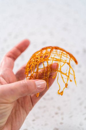 Photo for Crunchy caramel cupcake toppers on the counter. - Royalty Free Image