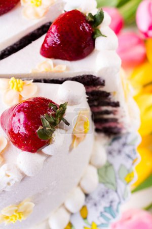 Photo for Chocolate Strawberry Lemon Torte made with 6 layers of chocolate cake, filled with lemon curd and strawberry mousse, covered in white chocolate cream cheese frosting. - Royalty Free Image