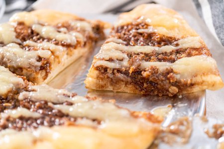Photo for Freshly baked cinnamon dessert pizza with cream cheese drizzle. - Royalty Free Image