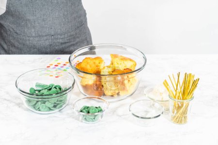 Photo for Measured ingredients in glass mixing bowls to make cactus cake pops for the Cinco de Mayo celebration. - Royalty Free Image