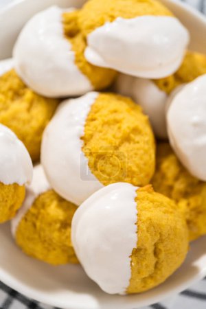 Photo for Lemon Cookies with White Chocolate. Freshly baked lemon cookies with white chocolate on a white ceramic plate. - Royalty Free Image