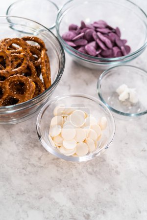 Photo for Measured ingredients in glass mixing bowls to make mermaid pretzel twists. - Royalty Free Image